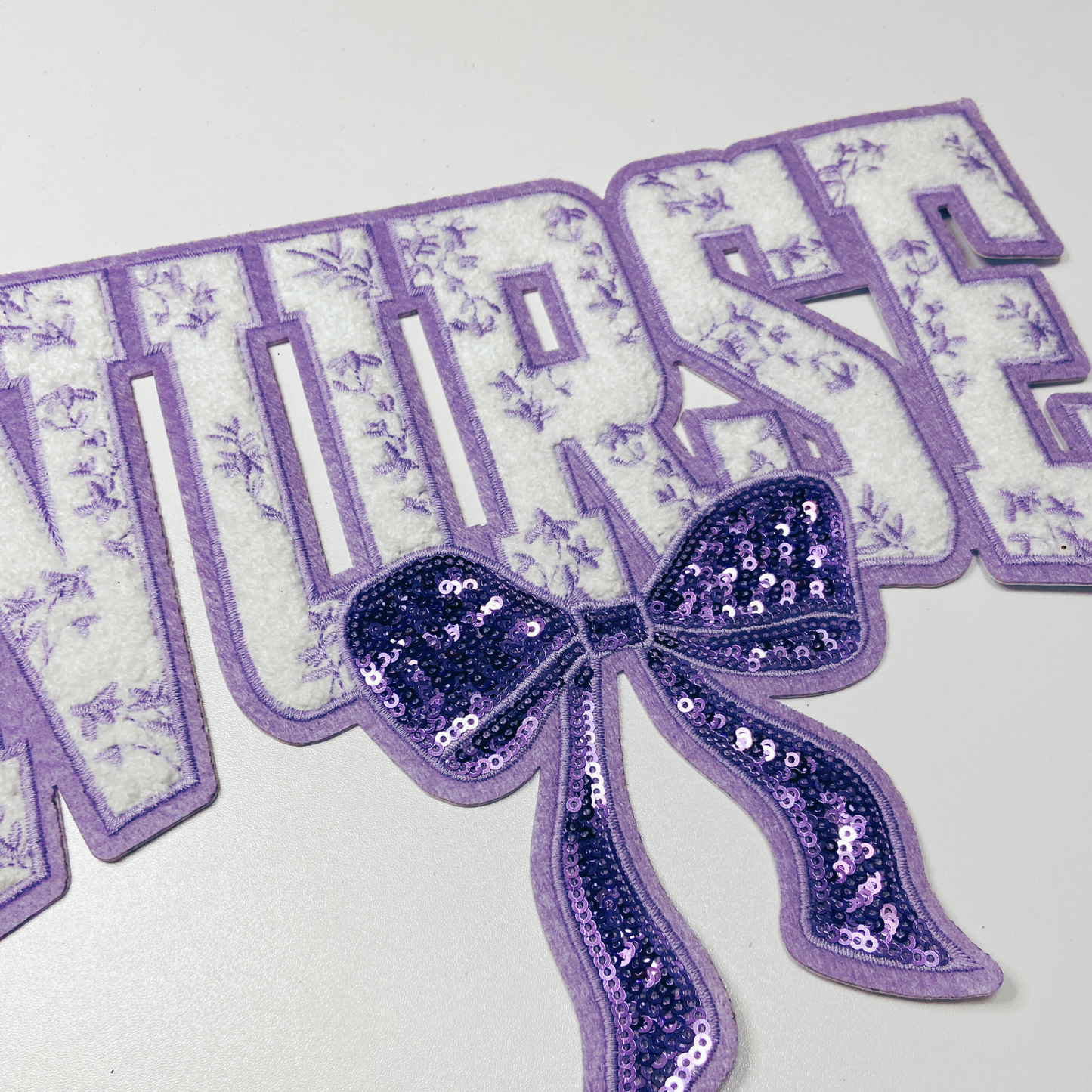 11" Nurse with sequin bow and embroidered Floral Purple - Sequin & Chenille Patch