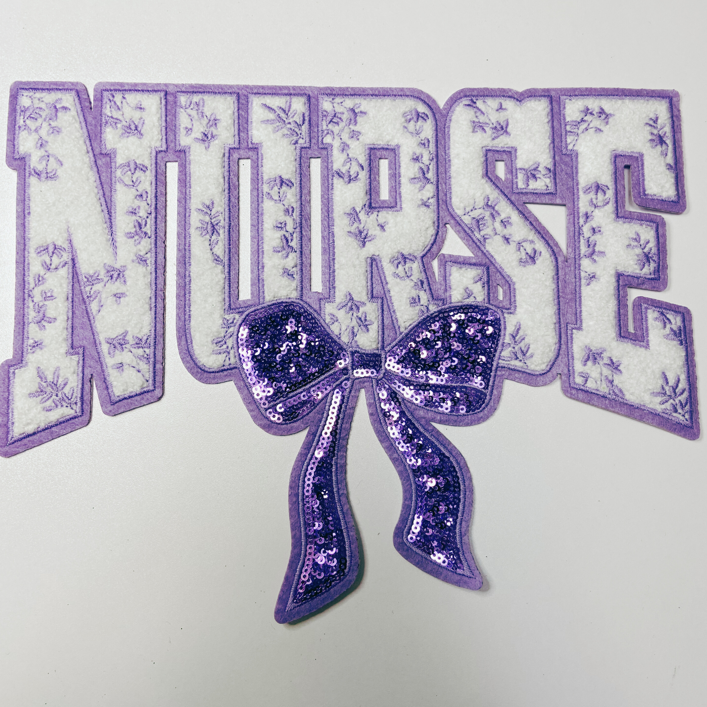 11" Nurse with sequin bow and embroidered Floral Purple - Sequin & Chenille Patch